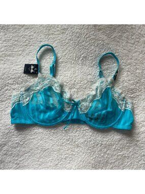 Blue lacy unlined bra with adjustable straps and bow detail